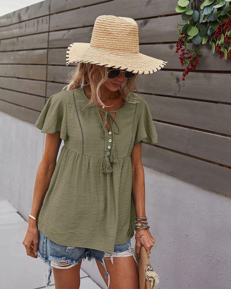 Blusa con mangas sueltas y cuello anudado