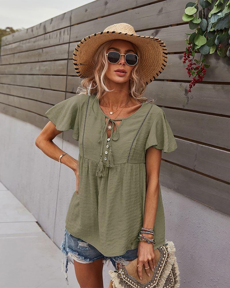 Blusa con mangas sueltas y cuello anudado