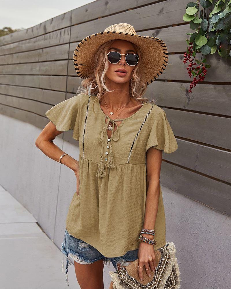 Blusa con mangas sueltas y cuello anudado