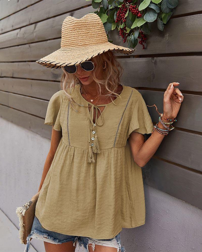 Blusa con mangas sueltas y cuello anudado