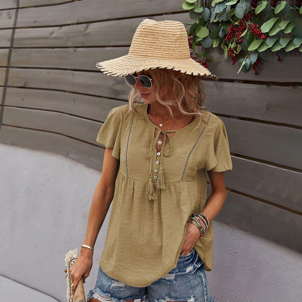 Blusa con mangas sueltas y cuello anudado