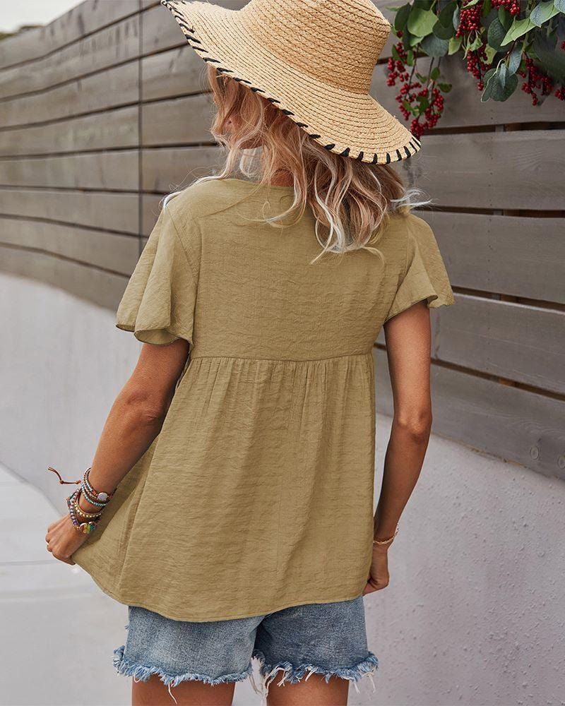 Blusa con mangas sueltas y cuello anudado