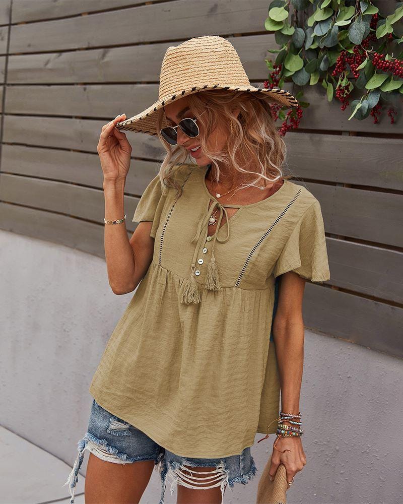 Blusa con mangas sueltas y cuello anudado