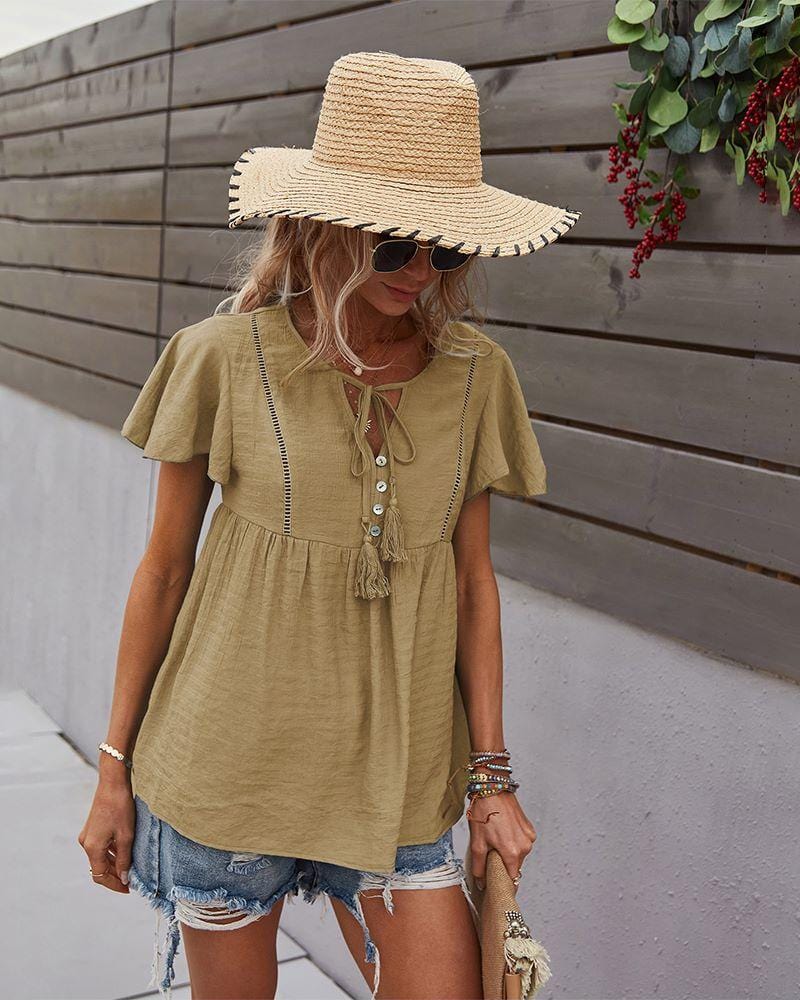 Blusa con mangas sueltas y cuello anudado