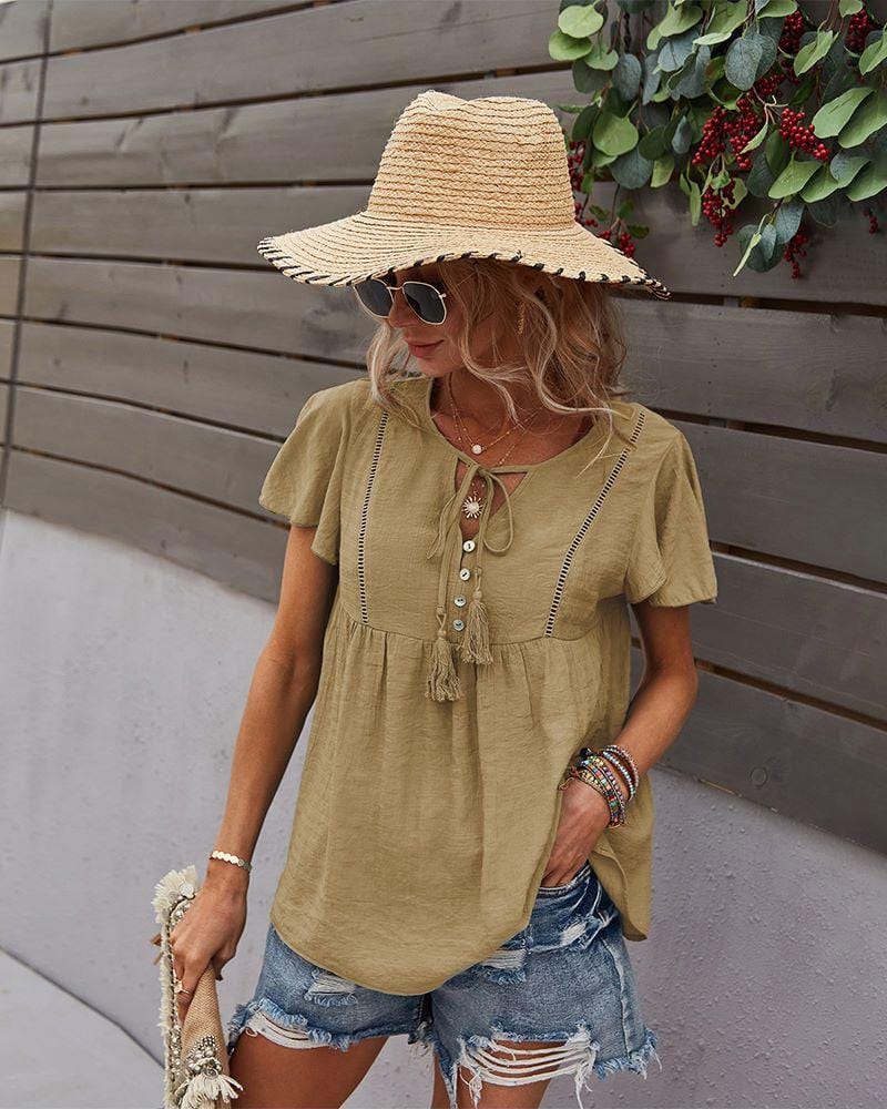 Blusa con mangas sueltas y cuello anudado