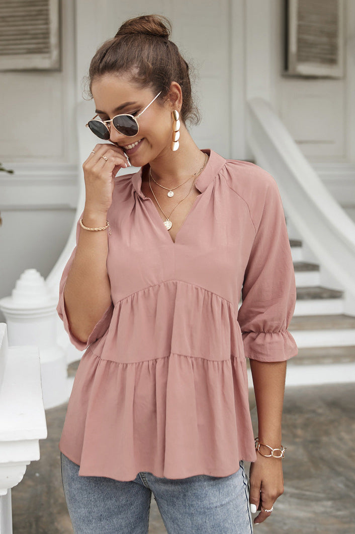 Blusa con cuello alto y capas