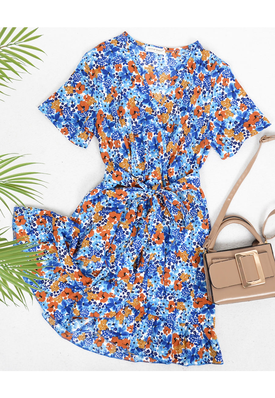 Vestido floral con dobladillo con volantes cruzados