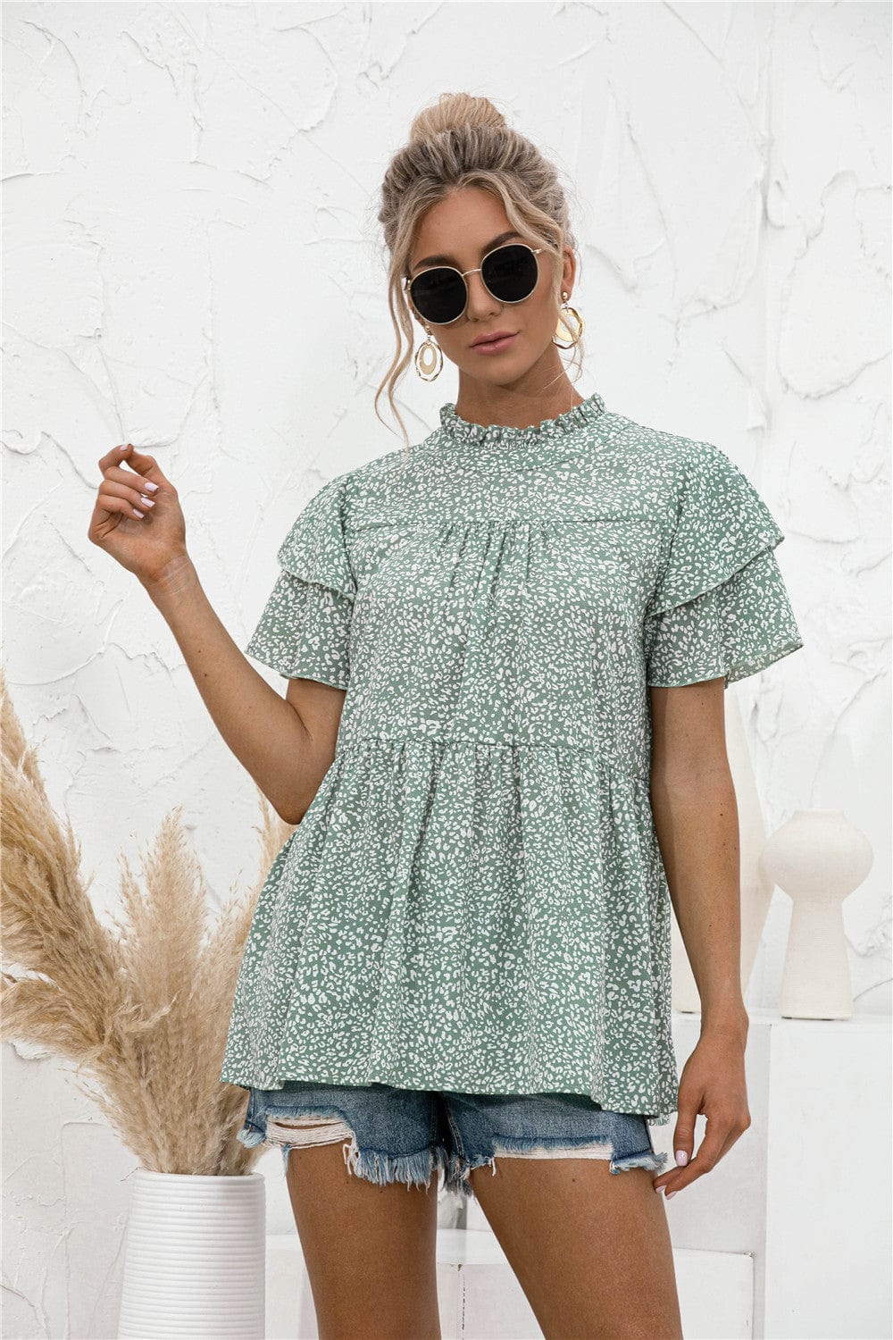 Blusa con mangas escalonadas y estampado animal