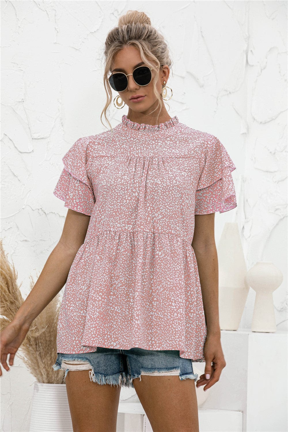 Blusa con mangas escalonadas y estampado animal