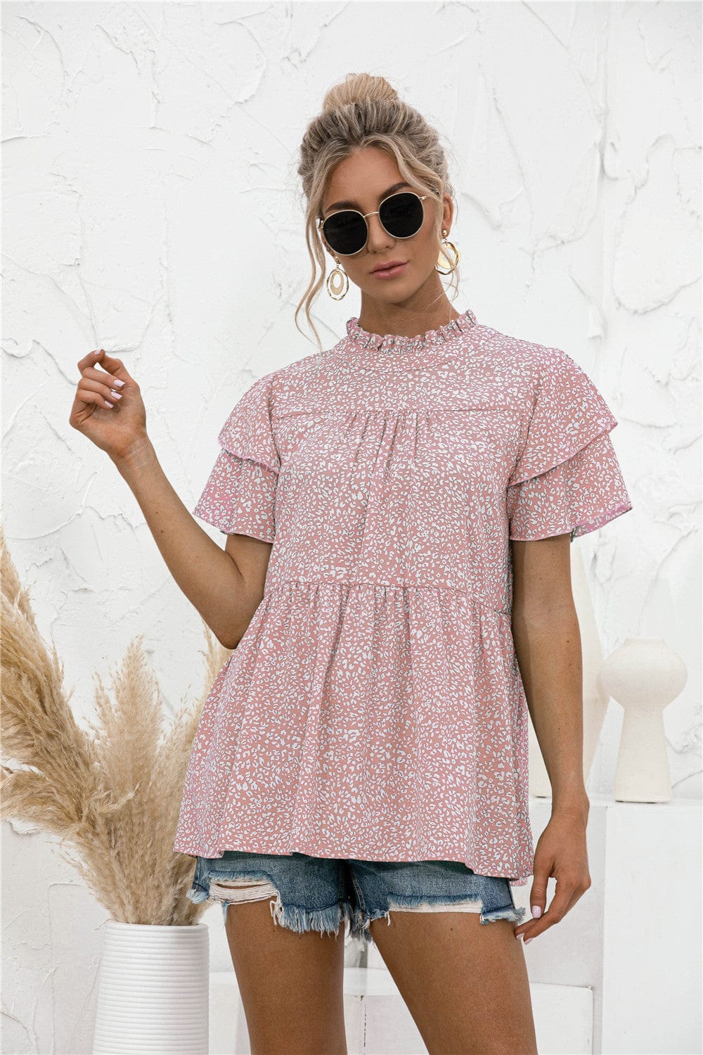 Blusa con mangas escalonadas y estampado animal
