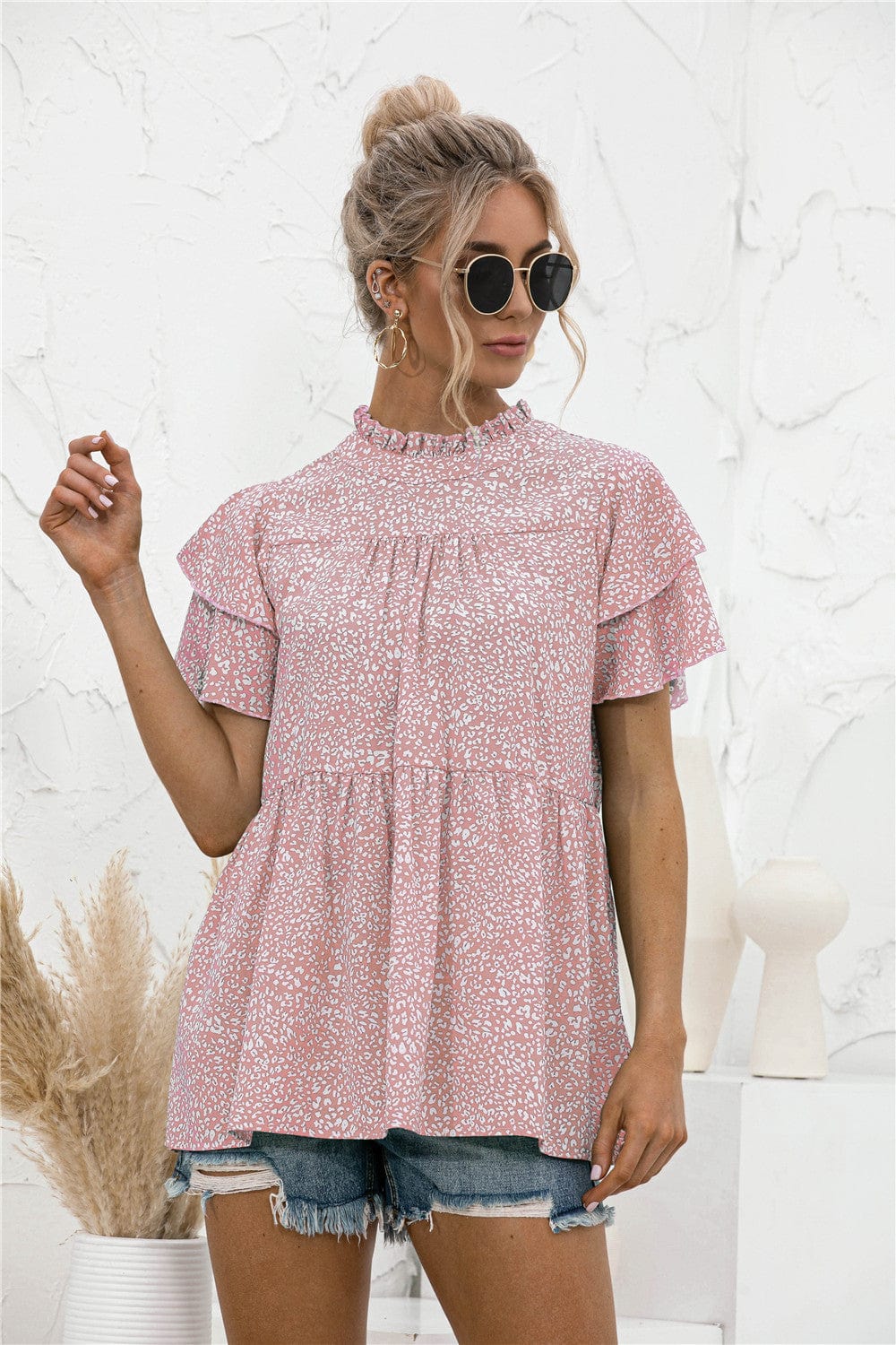 Blusa con mangas escalonadas y estampado animal