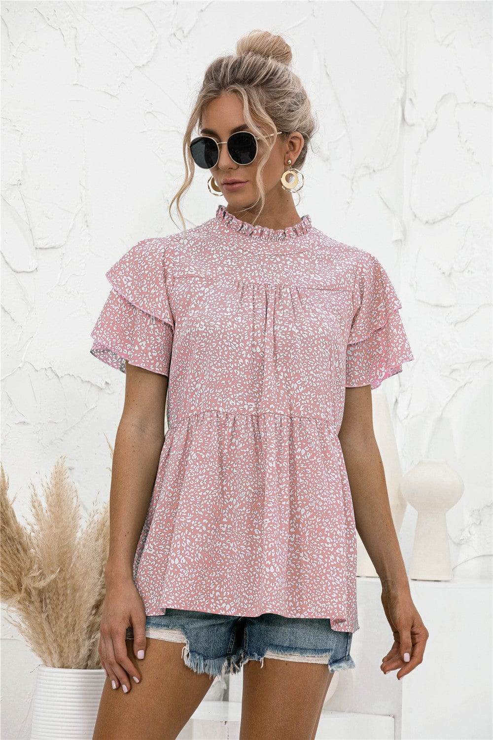 Blusa con mangas escalonadas y estampado animal