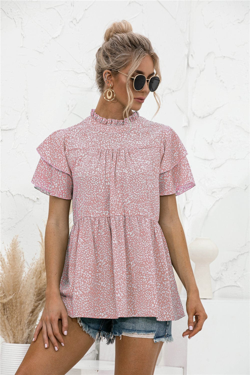 Blusa con mangas escalonadas y estampado animal