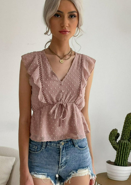 Blusa peplum con volantes y lunares suizos