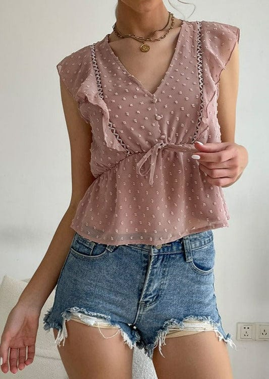 Blusa peplum con volantes y lunares suizos
