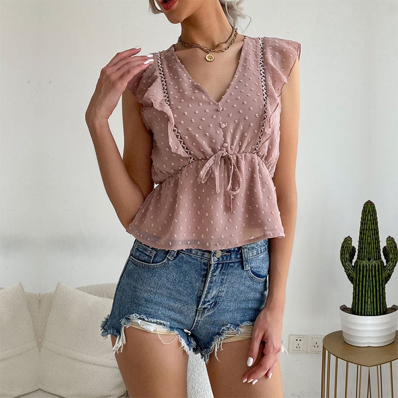 Blusa peplum con volantes y lunares suizos