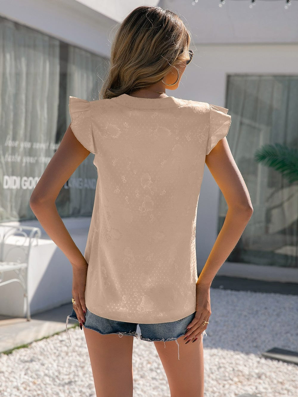 Blusa con mangas con volantes y estampado minimalista
