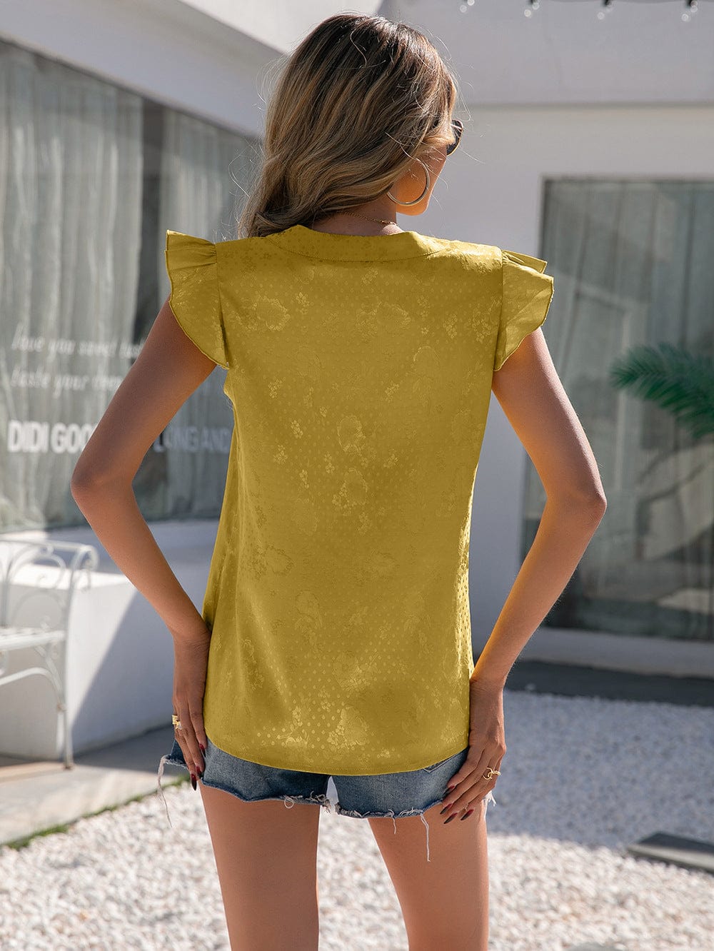 Blusa con mangas con volantes y estampado minimalista