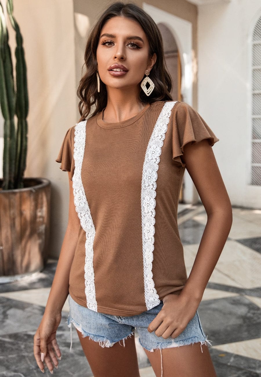 Blusa con mangas abullonadas y ribete de encaje