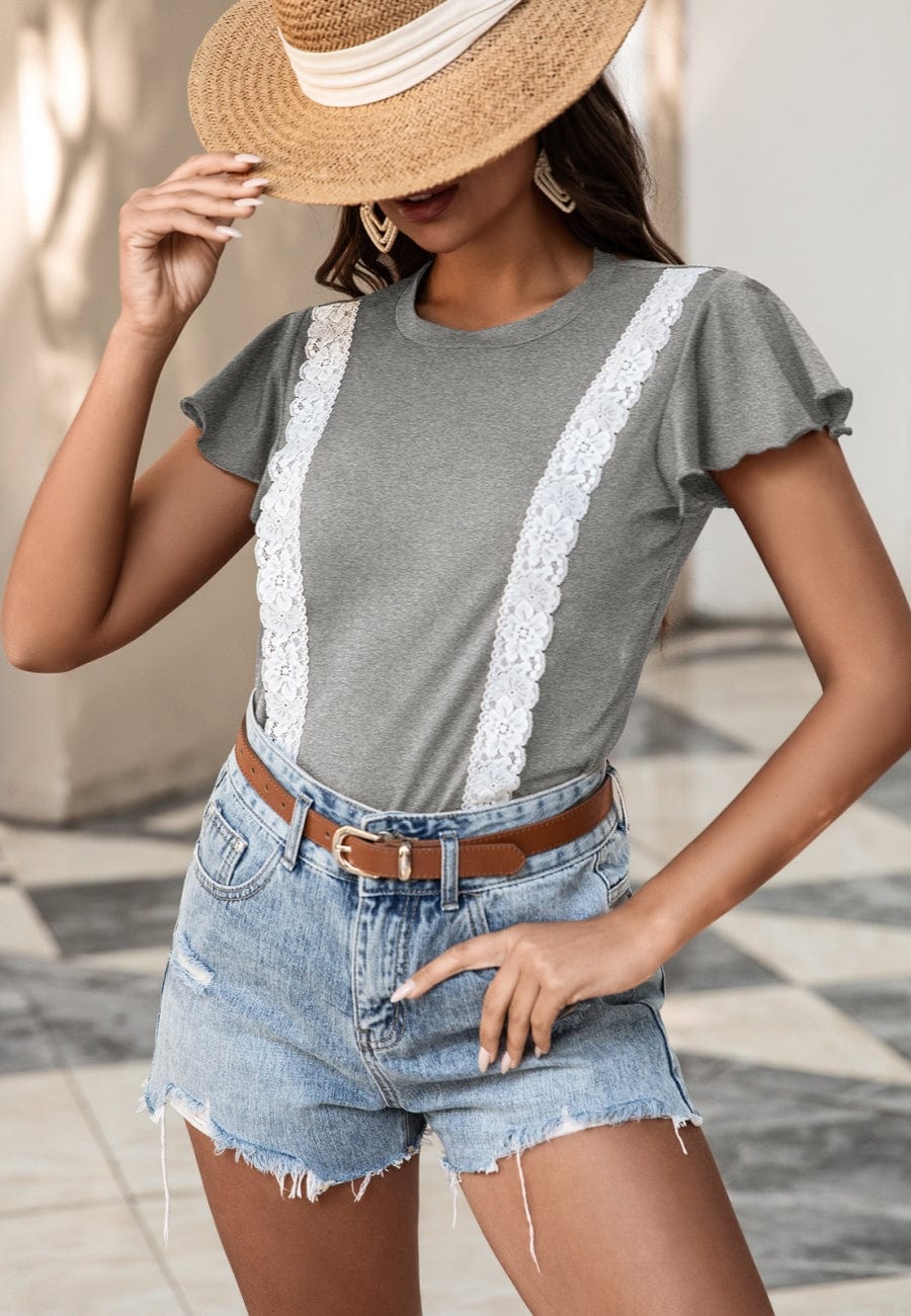 Blusa con mangas abullonadas y ribete de encaje