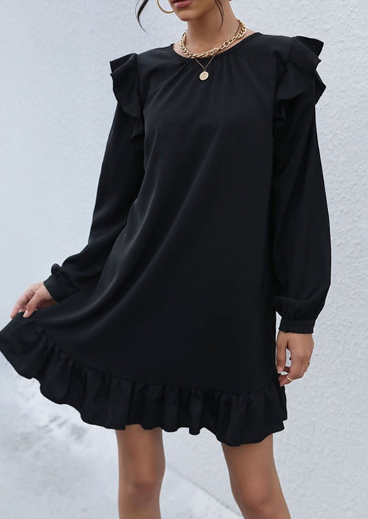 Vestido con detalle de volante y lazo en la espalda