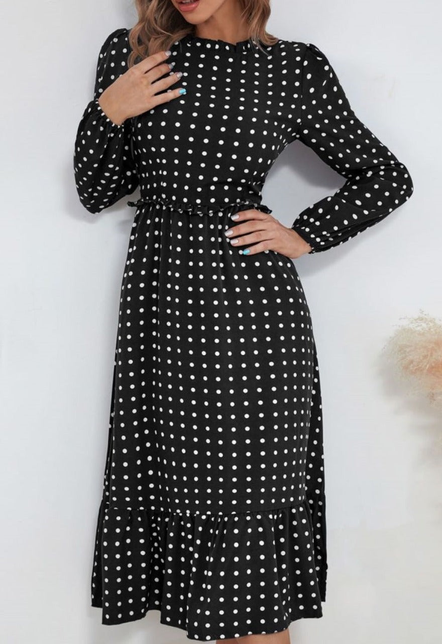 Vestido midi con escote redondo y bajo con volantes