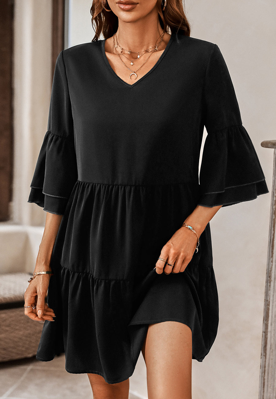 Vestido con mangas con volantes y capas de color liso
