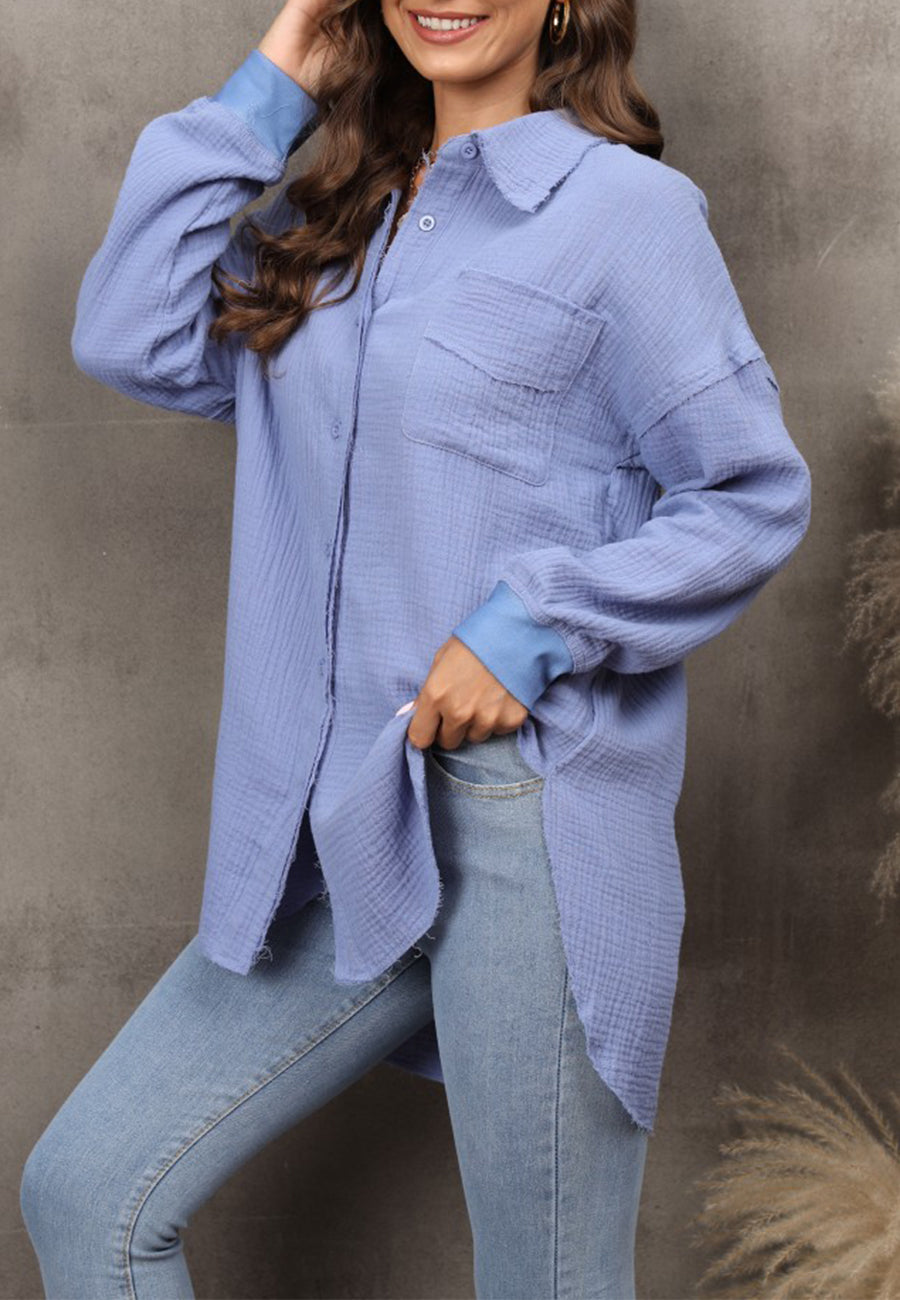Blusa con hombros caídos y dobladillo redondeado