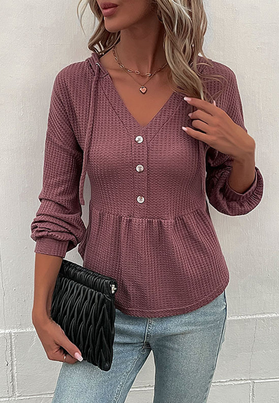 Suéter de punto peplum con capucha