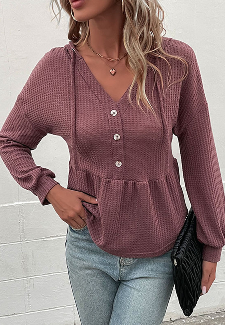 Suéter de punto peplum con capucha