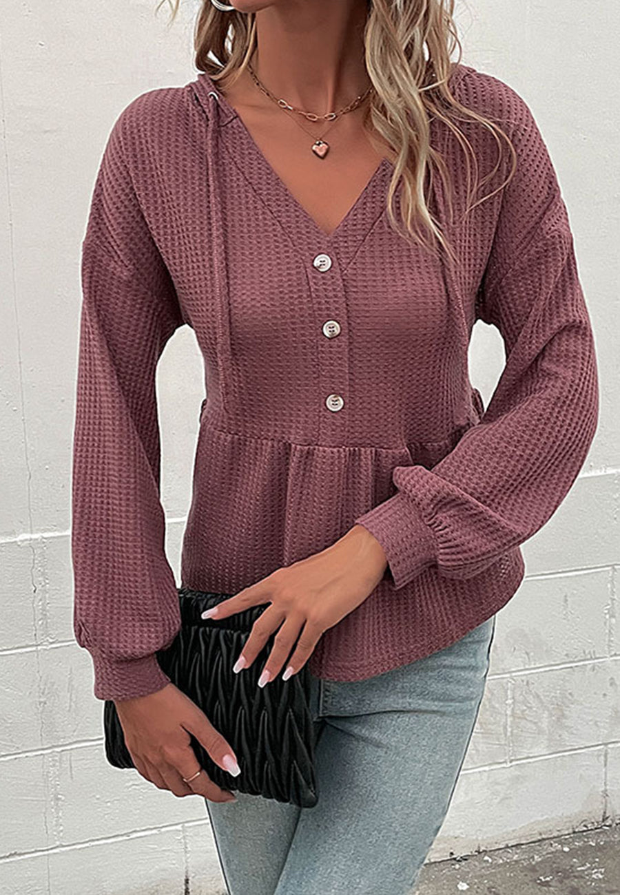 Suéter de punto peplum con capucha