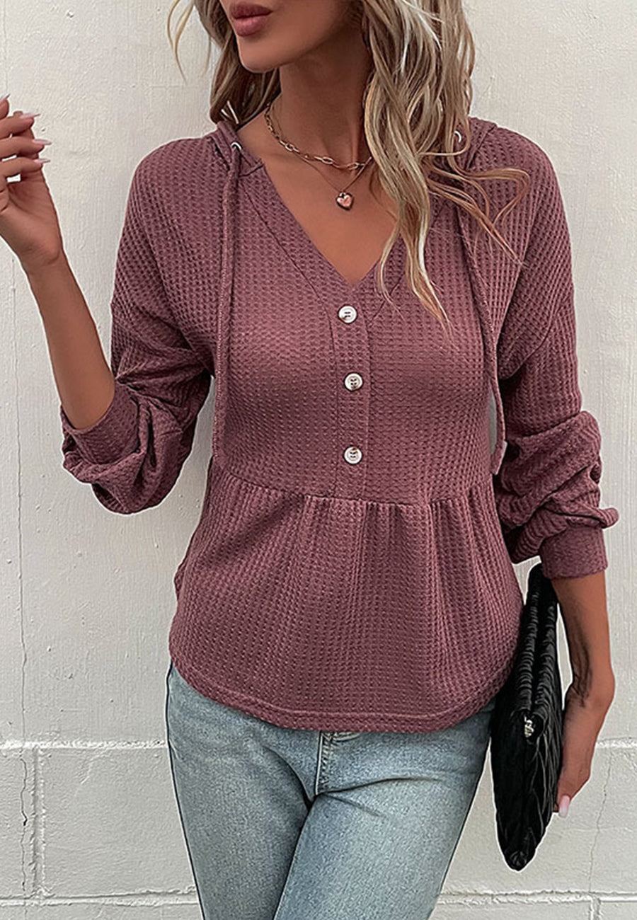 Suéter de punto peplum con capucha