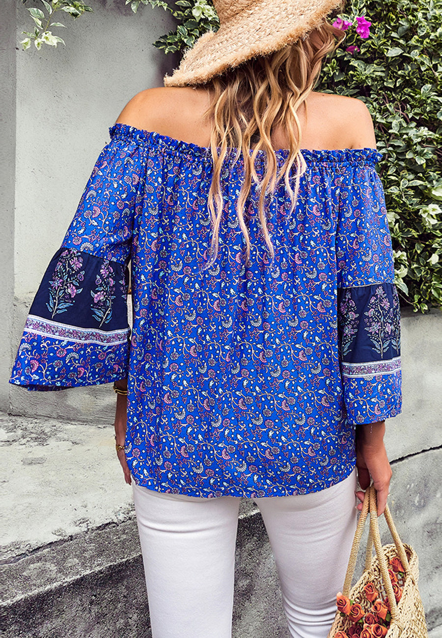 Blusa con borlas y hombros descubiertos