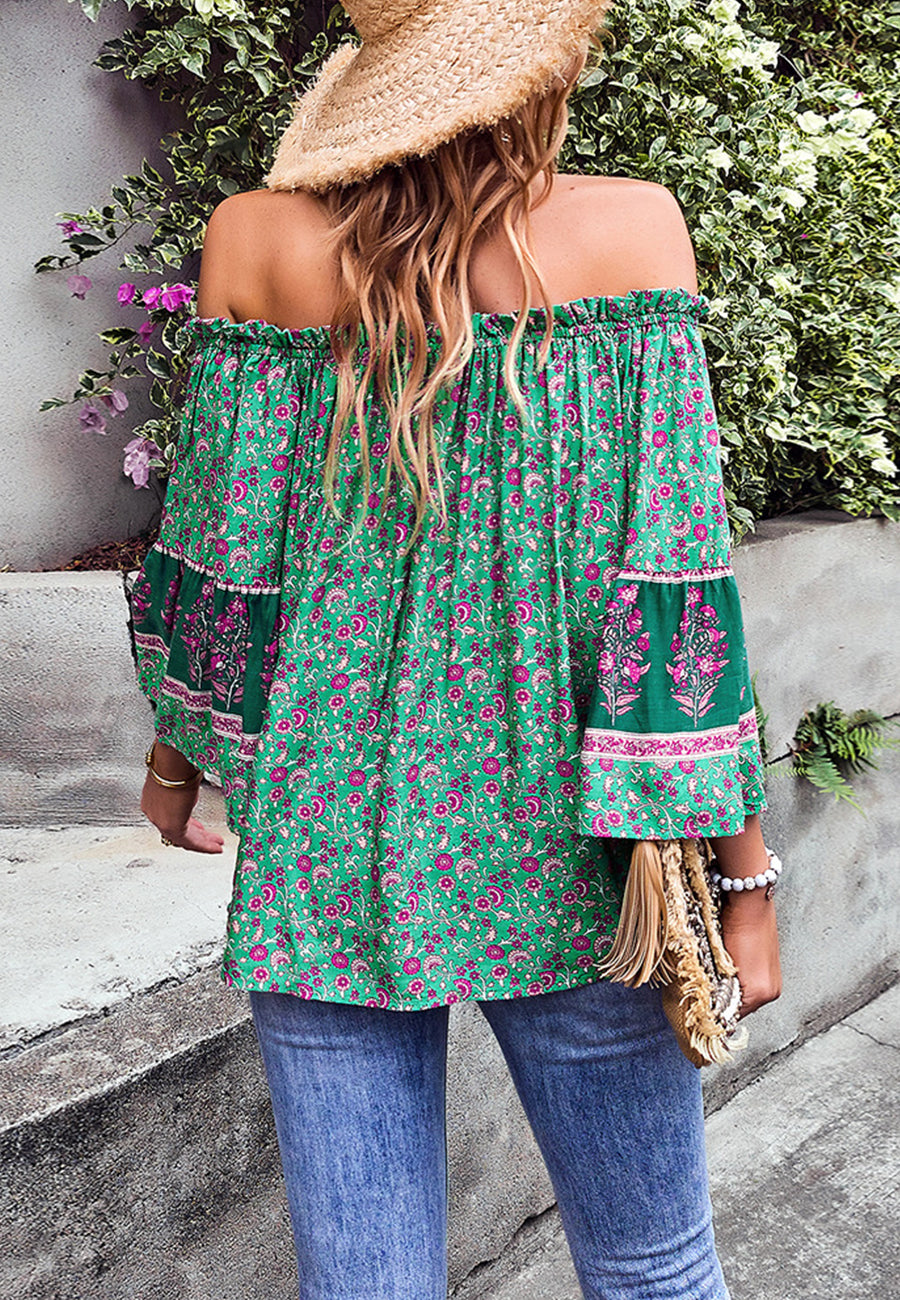Blusa con borlas y hombros descubiertos