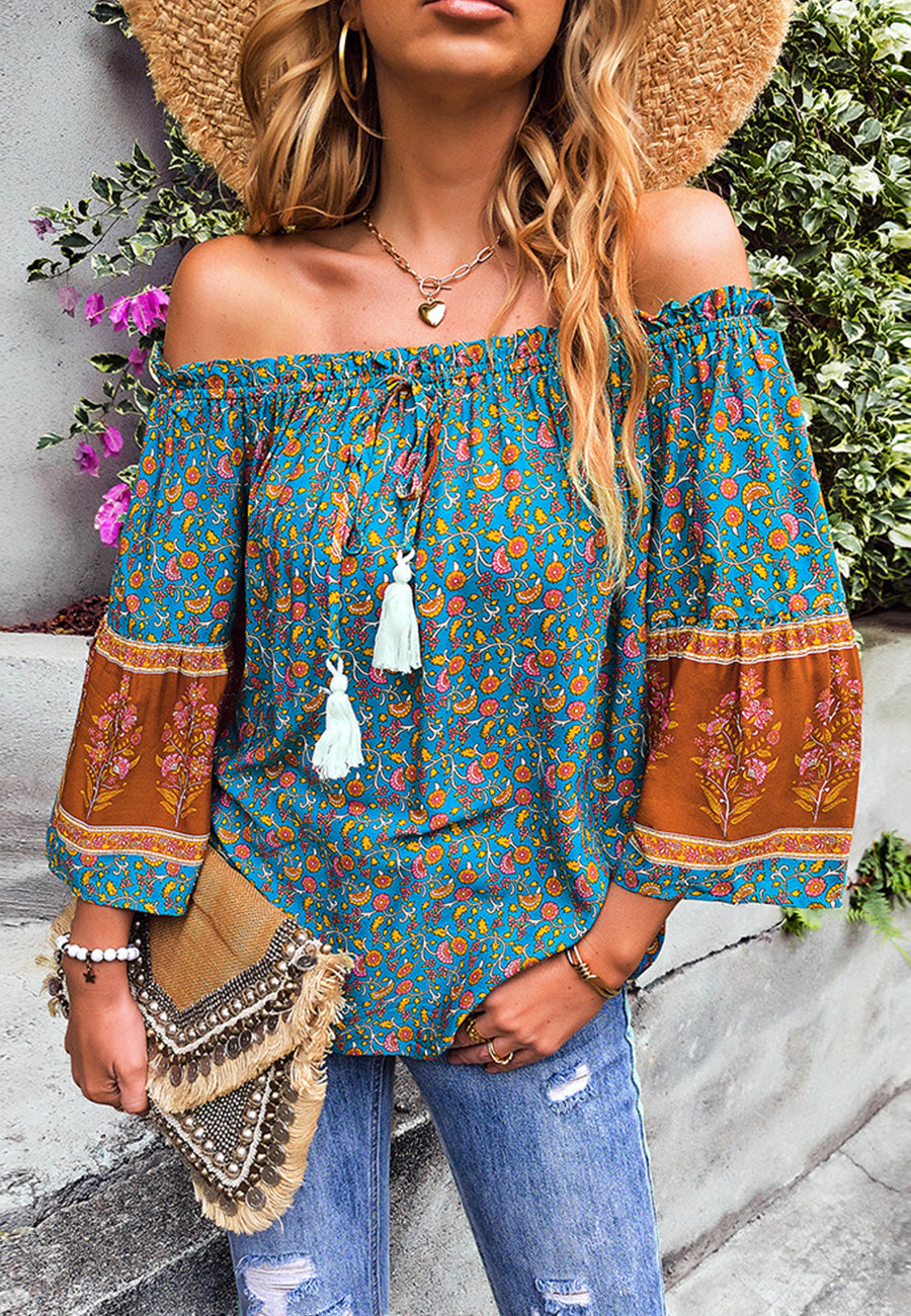 Blusa con borlas y hombros descubiertos