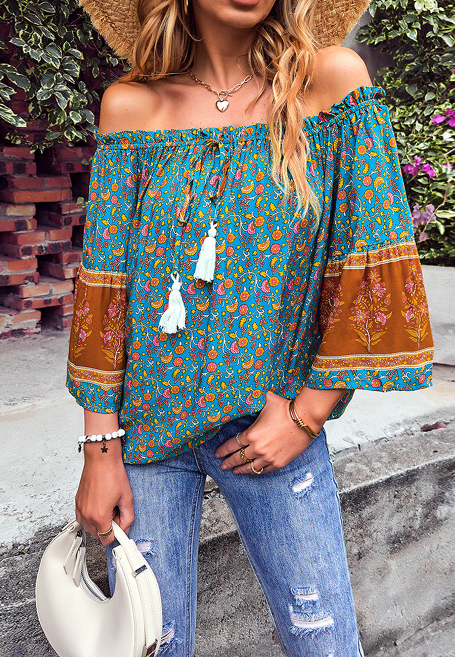 Blusa con borlas y hombros descubiertos