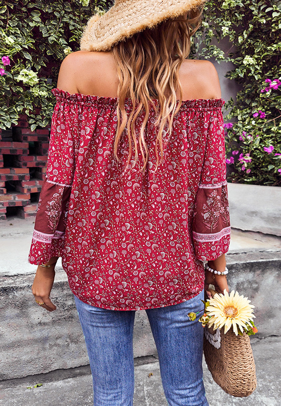 Blusa con borlas y hombros descubiertos