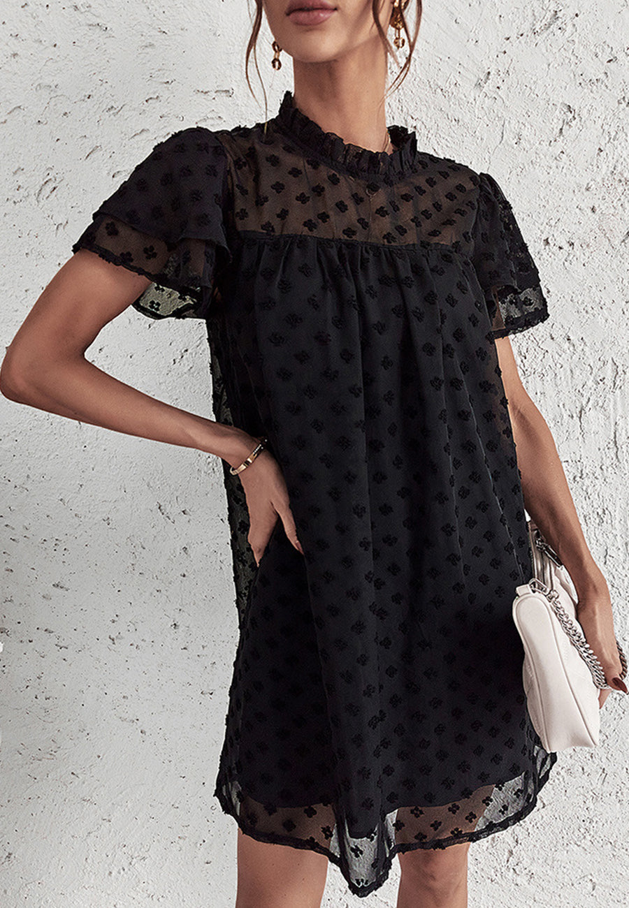 Vestido con mangas abullonadas y capas