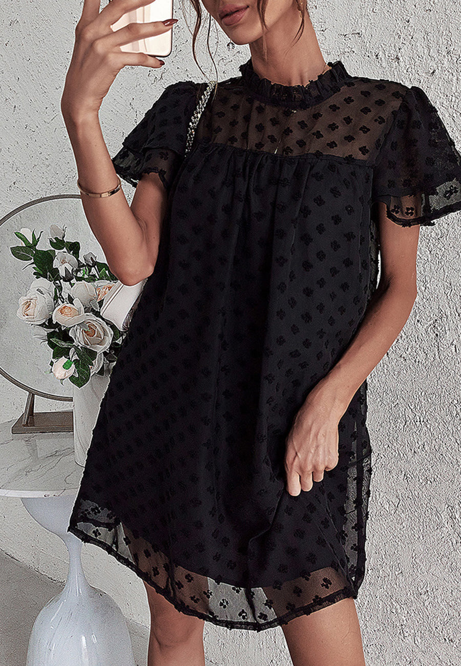 Vestido con mangas abullonadas y capas
