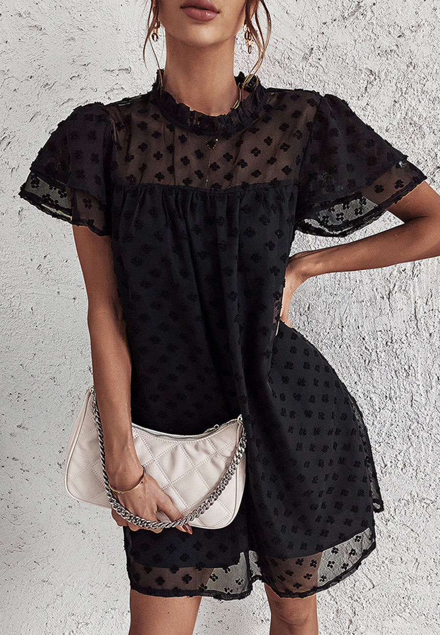 Vestido con mangas abullonadas y capas