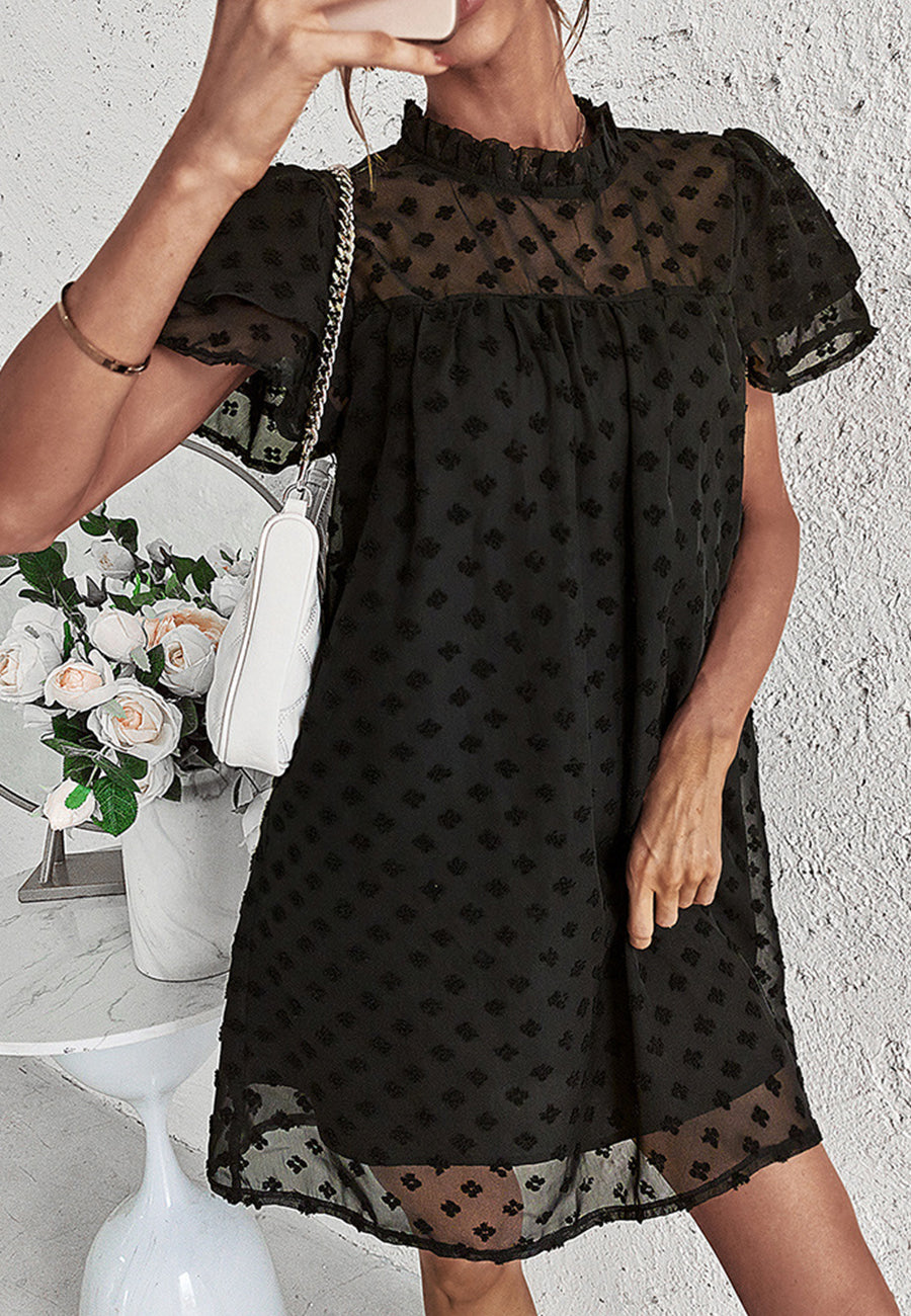 Vestido con mangas abullonadas y capas