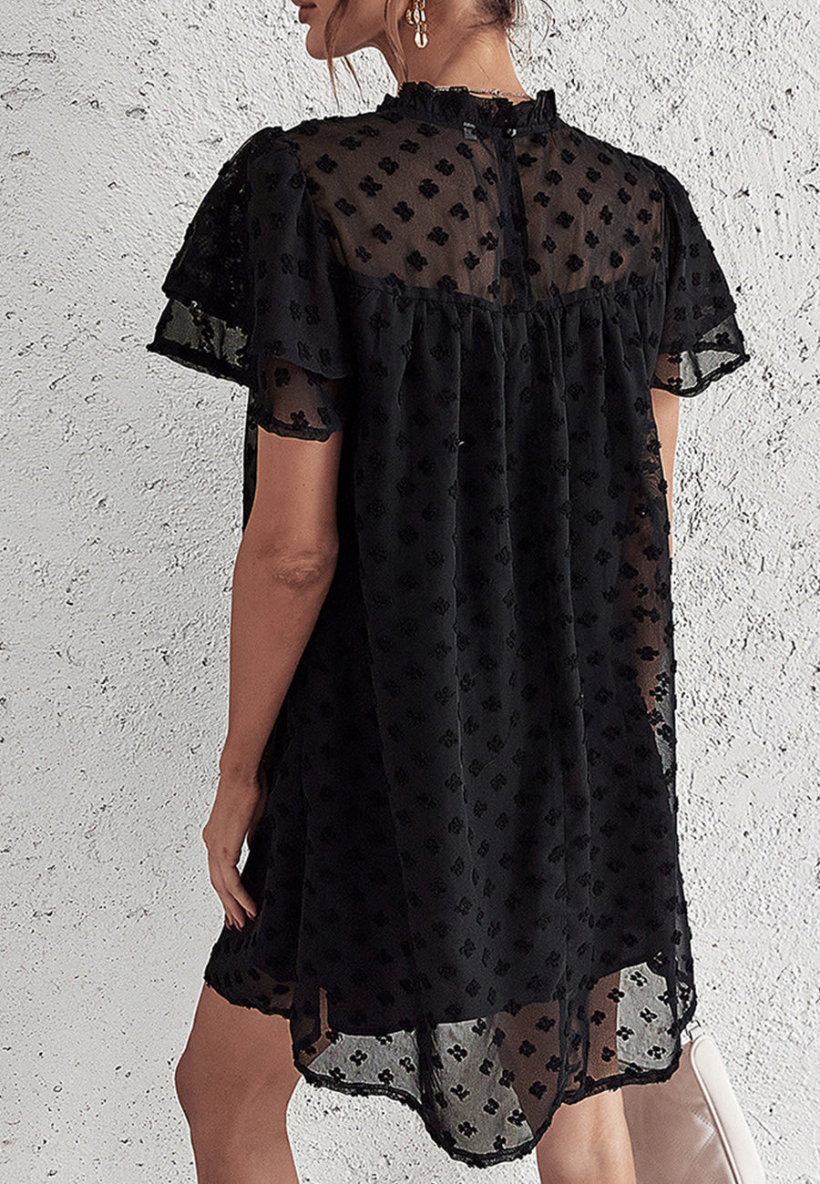 Vestido con mangas abullonadas y capas