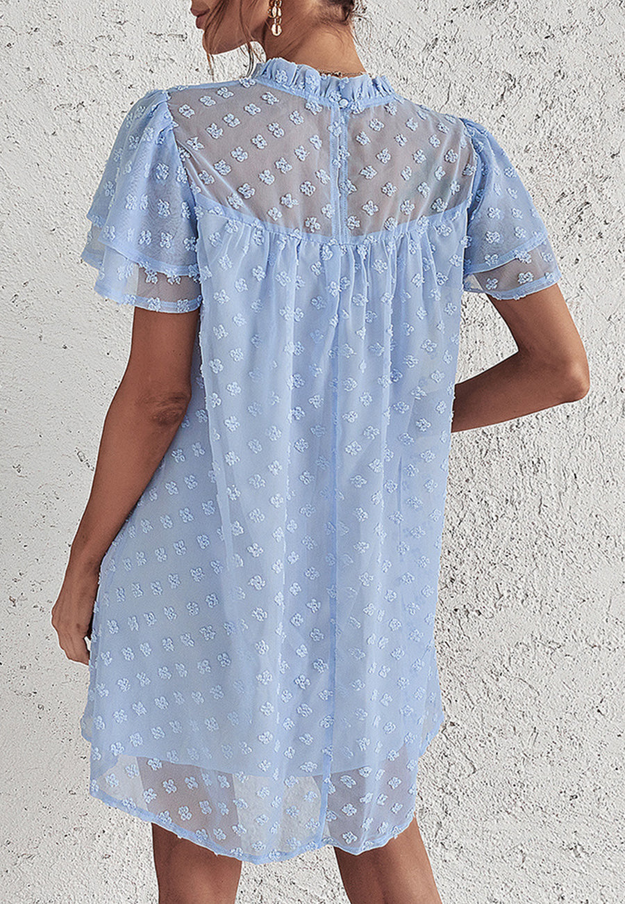 Vestido con mangas abullonadas y capas