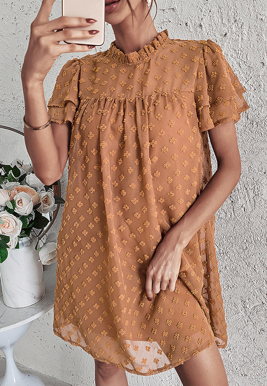 Vestido con mangas abullonadas y capas