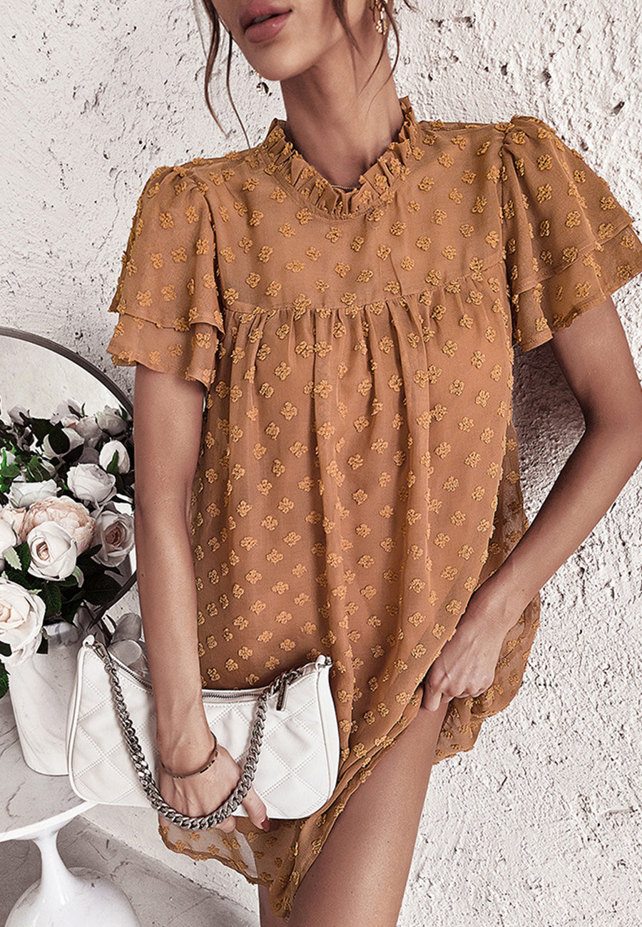 Vestido con mangas abullonadas y capas