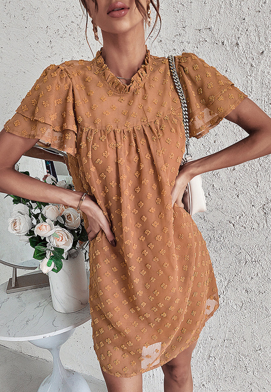 Vestido con mangas abullonadas y capas