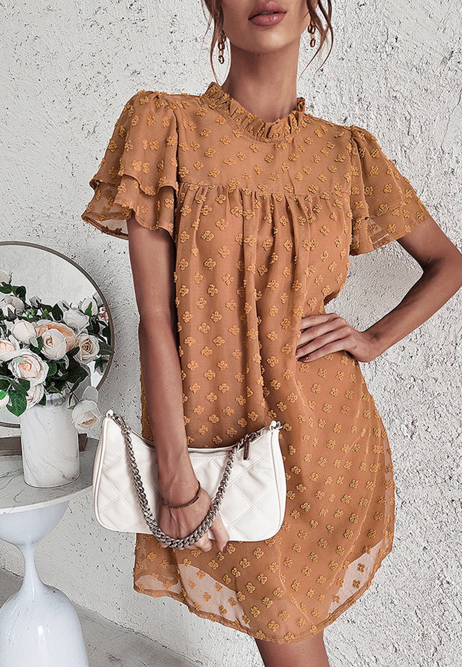 Vestido con mangas abullonadas y capas