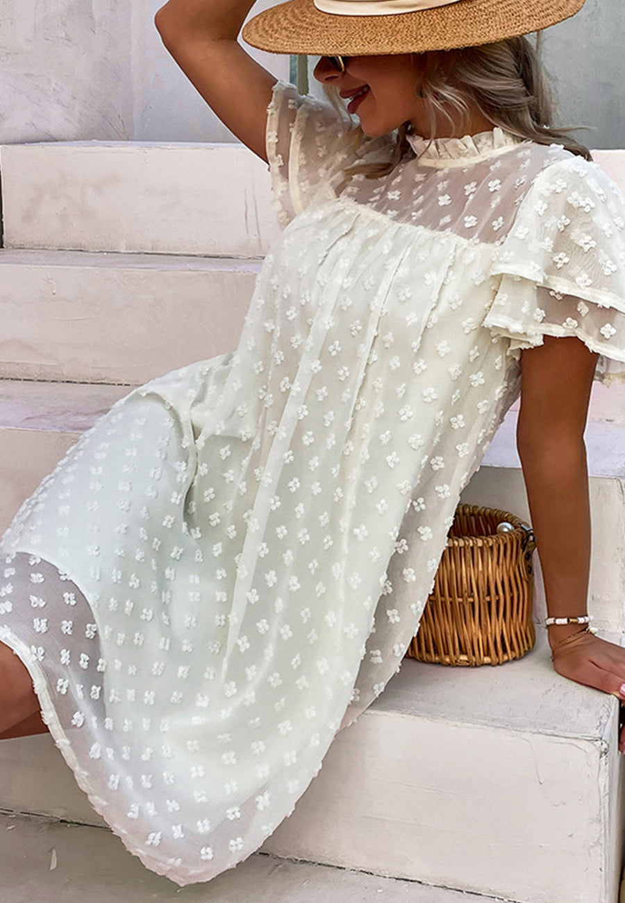 Vestido con mangas abullonadas y capas