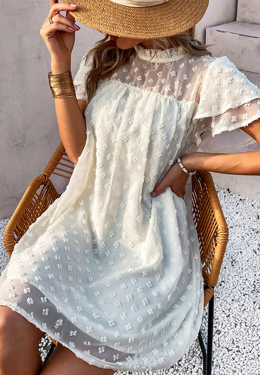 Vestido con mangas abullonadas y capas