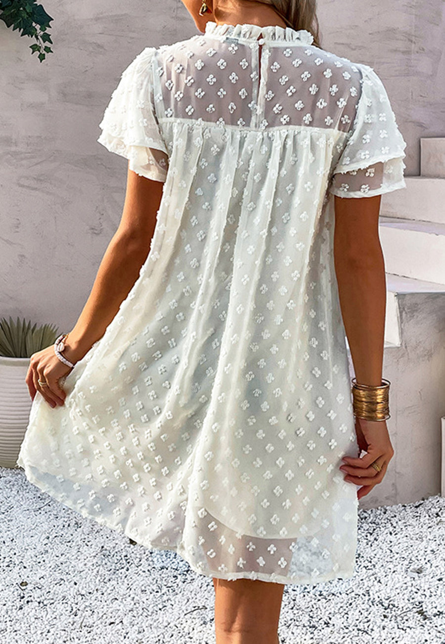 Vestido con mangas abullonadas y capas